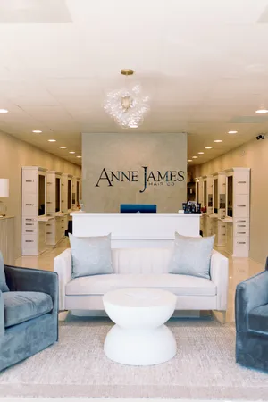 salon lobby with lavish couch and products in background